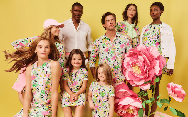 Group shot of women, men and girls wearing outfits in the Disney Lilly Pulitzer print